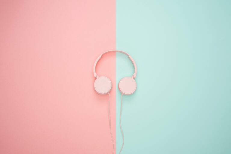 Pink and green noise cancelling headset by icons8: unsplash.com